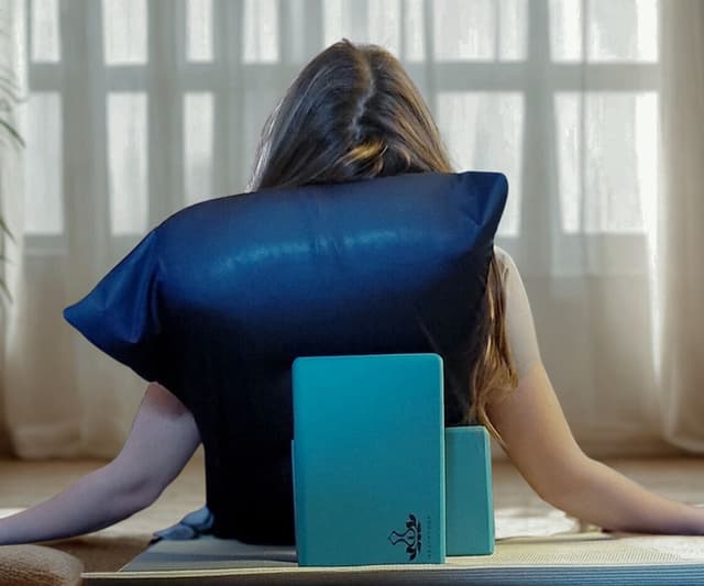 Restorative yoga with bolster